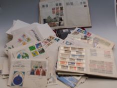 A large quantity of first day covers and Triumph stamp album, stockbooks, presentation stamps,
