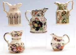 Five Mason's pottery jugs including Mandarin and Appliqué patterns and Liberty example