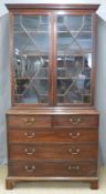 Georgian mahogany chest of two over three drawers with astragal glazed bookcase above,
