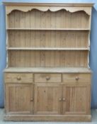 Pine dresser with plate rack top, the base fitted three drawers and three cupboards,