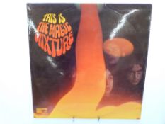 The Magic Mixture - This Is The Magic Mixture (FID2125), condition of the record appears ex,