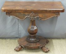 Victorian rosewood fold over card table with bulbous octagonal support and circular base,