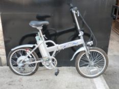 An electric folding bicycle in silver