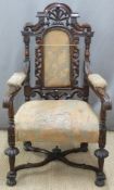 Carved oak armchair with scrolling stretcher