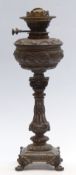 A 19th / 20thC cast metal oil lamp with Messengers no 2 patent Duplex burner