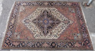 Kashkuli style carpet with all over multi-coloured decoration and fringed ends on navy blue ground,