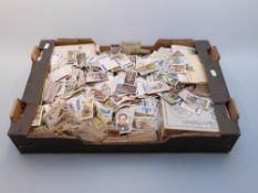 A large quantity of loose cigarette, tea and other cards, loose including sets and in albums,