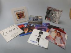 Approximately 100 singles mostly 1980s in two record cases