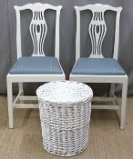 Two white painted chairs and a similar linen basket