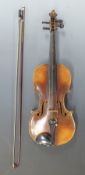 A late 19th / early 20thC anonymous full size violin with 36cm two piece flame back and mother of