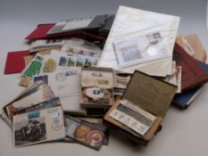 A box of first day covers, loose stamps and albums including 1932 Bechuanaland 2s, 2s6d,