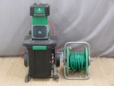 Gardenline garden shredder and a garden hose