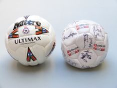 Two footballs believed to be signed by Cheltenham Town and Swindon Town football players including