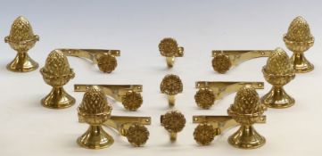 Three pairs of brass curtain pole fittings