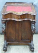 Victorian mahogany leather inset Davenport with serpentine front and carved supports,