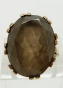 A 9ct gold ring set with a smoky quartz