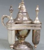 A silver plated triple table lighter with central lighter and three lances, 13cm tall