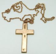 A 9ct rose gold cross and a 9ct gold chain, 3.7g