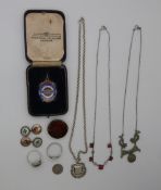 A collection of silver including a fob, another darts fobs, brooch set with agate, marcasite