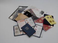 A collection of various coin packs, London Mint commemorative crowns etc