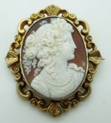 Victorian yellow metal swivel brooch set with a shell cameo, glass compartment verso