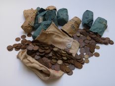 A large quantity of UK copper and brass coinage pennies, halfpennies and threepenny bits,