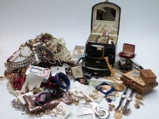 A collection of costume jewellery including brooches, beads, pearl earrings  etc
