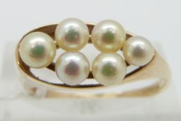 A 9ct gold ring set with pearls, size Q