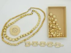 Two late 19thC beaded ivory necklaces, an ivory bracelet, carved ivory brooch and further ivory