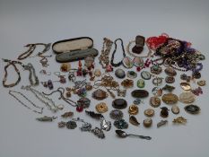A collection of jewellery including Victorian agate brooch, silver and marcasite brooch, beads,