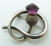 A Charles Horner hallmarked silver brooch depicting a thistle set with purple paste, 3.5 x 2.5cm