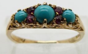 An 19ct gold ring set with turquoise and rubies.