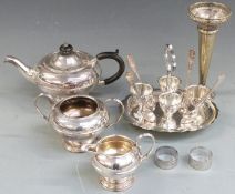 A plated tea set, egg cruet, vase etc