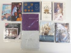 Royal Mint crown and coin sets in presentation packs to include Scouts fifty pence, Millennium