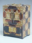 Chinese stained elm brass bound jewellery cabinet with decorative brass mounts and flush fit heart