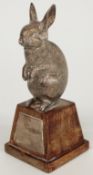 Modern hallmarked silver novelty rabbit on square tapering wooden base, London 1981 maker's mark