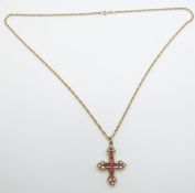 A yellow metal cross set with rubies and pearls and a 9ct gold chain, 10.2g