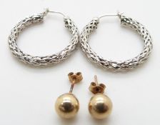 A pair of 9ct white gold earrings and a pair of gold studs, 1.8g
