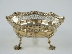 George V hallmarked silver gilt bonbon dish with pierced decoration, raised on four pad feet,