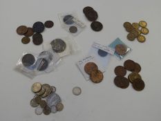 A small interesting collection of UK and overseas coinage, small silver content including a