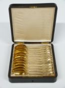 Cased set of 12 Fench gilt white metal teaspoons with French silver mark and indistinct maker's mark