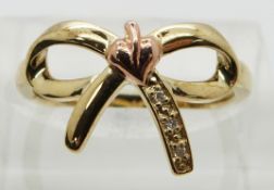 Clogau 9ct gold ring in the form of a bow set with diamonds, in original box, size L