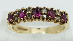 A 9ct gold ring set with rubies and diamonds, size N