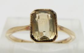 A 9ct gold ring set with an emerald cut citrine, size N