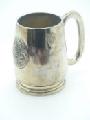 Eastern white metal pint tankard with embossed circular plaque of a deity, marked to base Thailand