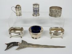 A pair of hallmarked silver salts by Walker & Hall, pedestal salt by the same maker, two peppers,