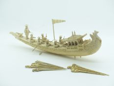 Late 19th/20thC carved ivory and bone boat with figures etc, length 28cm, together with eight carved