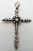 Georgian cross pendant set with old mine cut diamonds in a silver setting, the largest diamond