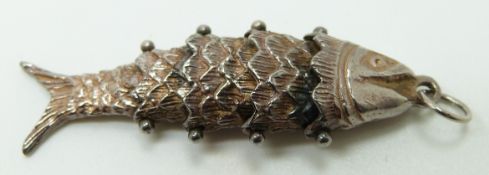 A silver fish pendant