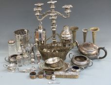 A quantity of silver plate including candelabra, cocktail shakers, teapot, hallmarked silver pepper,